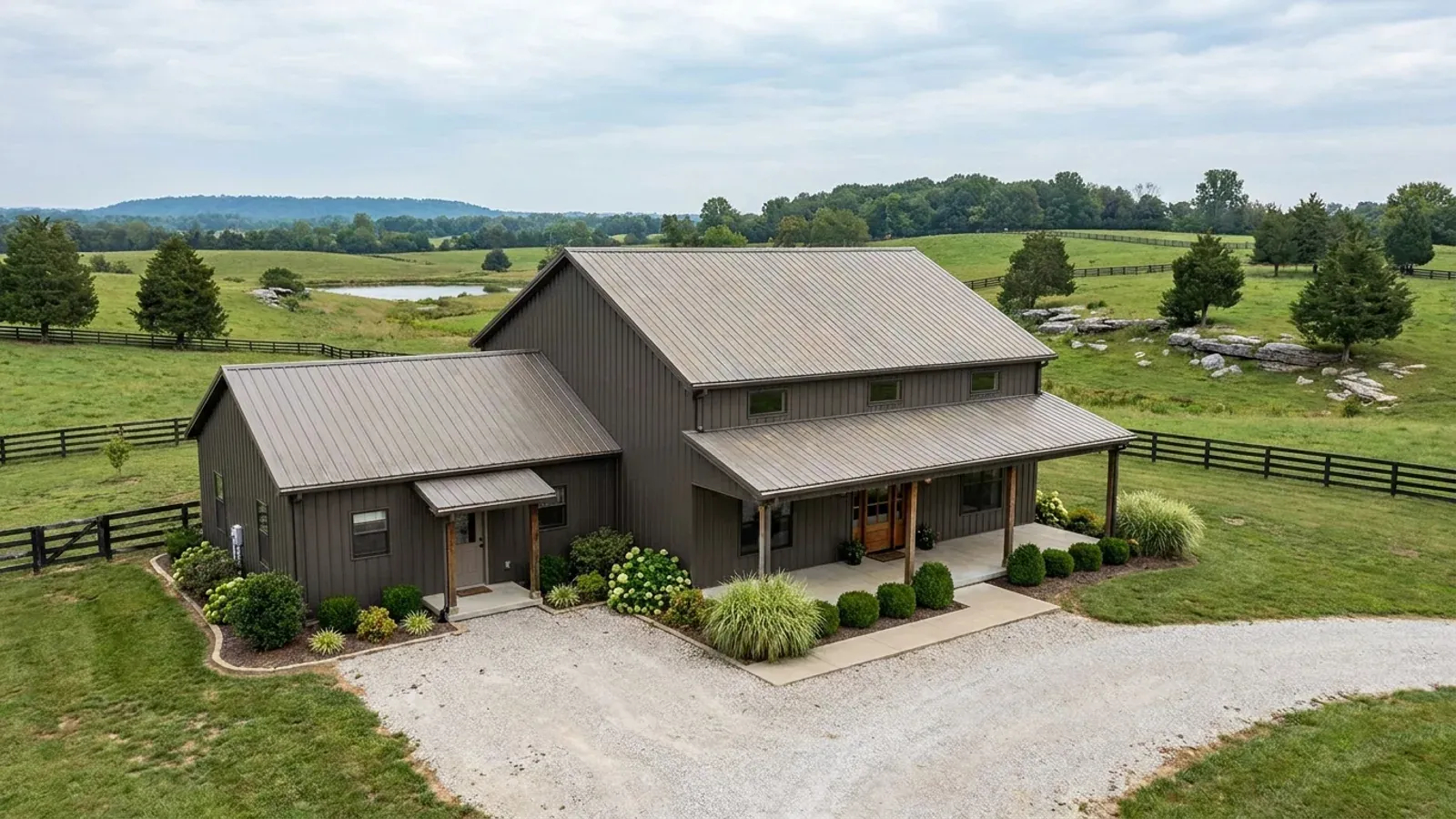 A barndominium with a smaller attached in-law suite wing that has its own separate covered entry, distinct from the main entry.